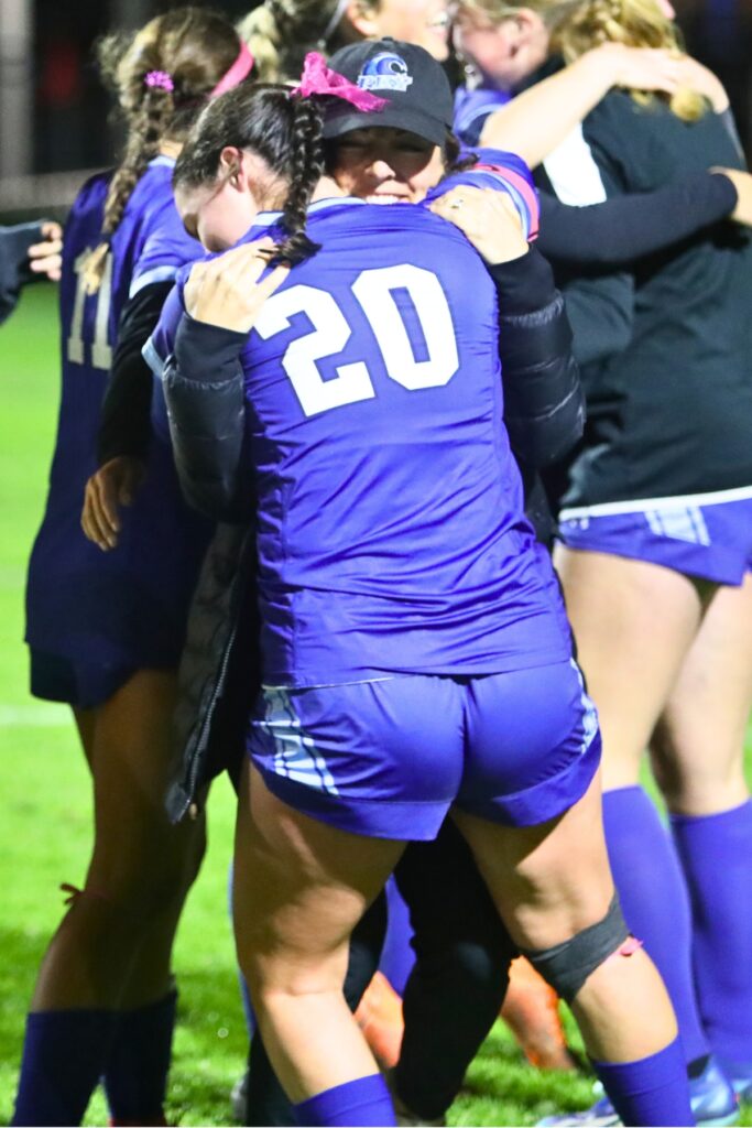 P.K. Yonge coach Rebecca Schackow hugs her daughter, Marleigh Schackow, after the Lady Blue Wave defeated Episcopal (Jacksonville) , 2-1, in the 3A-Region 1 Final.