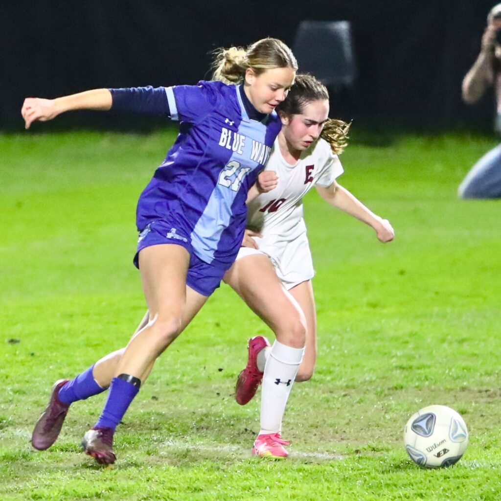 P.K. Yonge's Emma Mansfield (21) battles for the ball against Episcopal (Jacksonville).