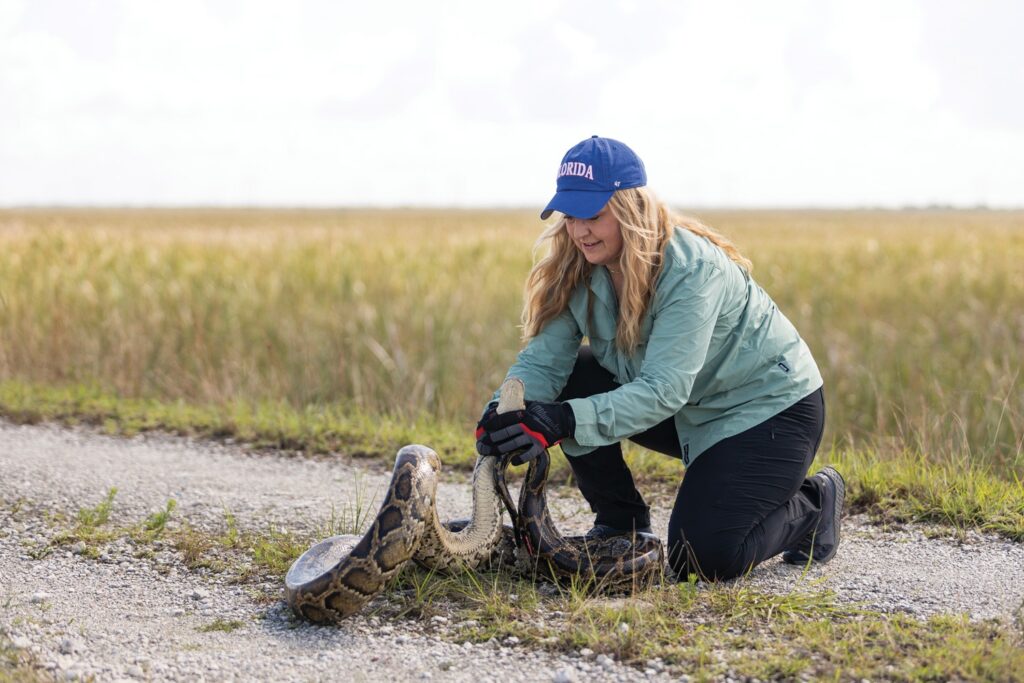 Melissa Miller releases a scout snake.