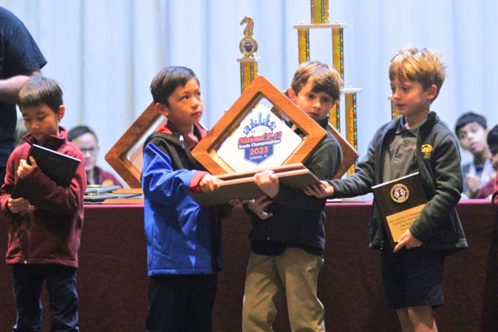 The Eagles' first grade team receives their awards.