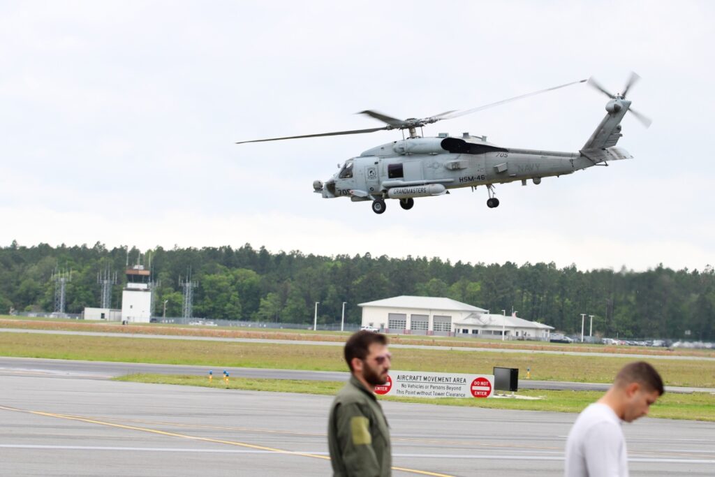 A Navy helicopter takes off Friday from the University Air Center before the Gator Fly-In scheduled for Saturday.
