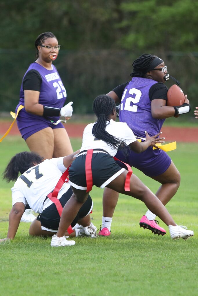 Buchholz's Reniyah Brown goes after Gainesville's Na'zarri Allen's flag in a March 7 game.