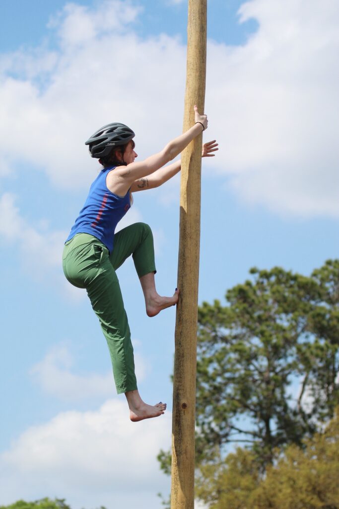 Caitlyn Cavender competes in the pole climbing event at the 65th annual Southeastern Conclave university forestry skills competition on March 15-16.