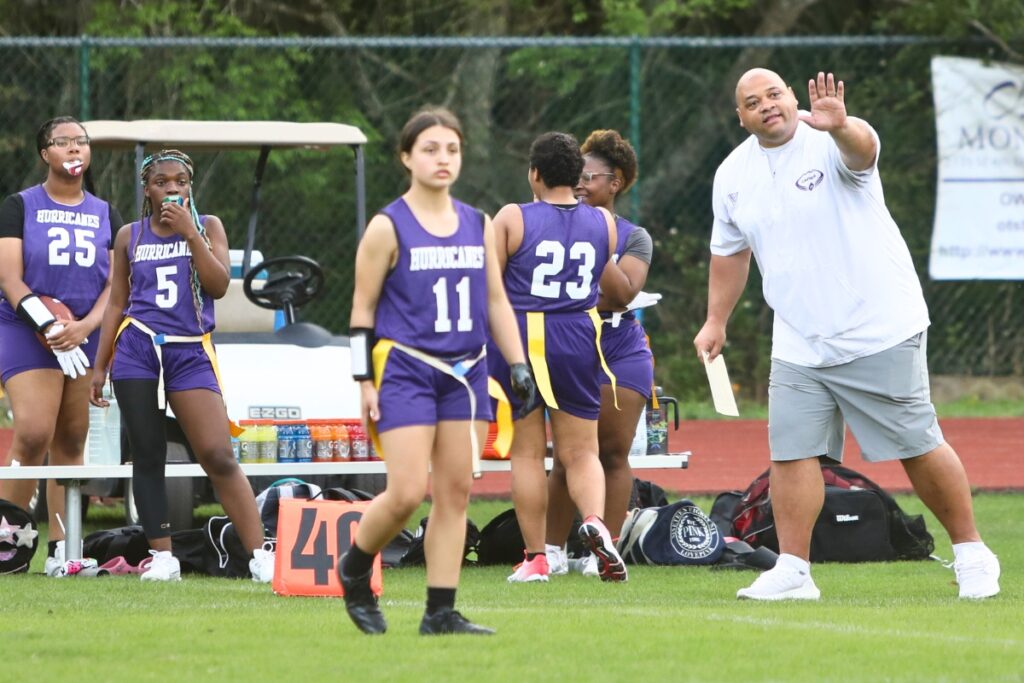 Gainesville flag football coach Ian Scott directs his players against Buchholz on March 7.