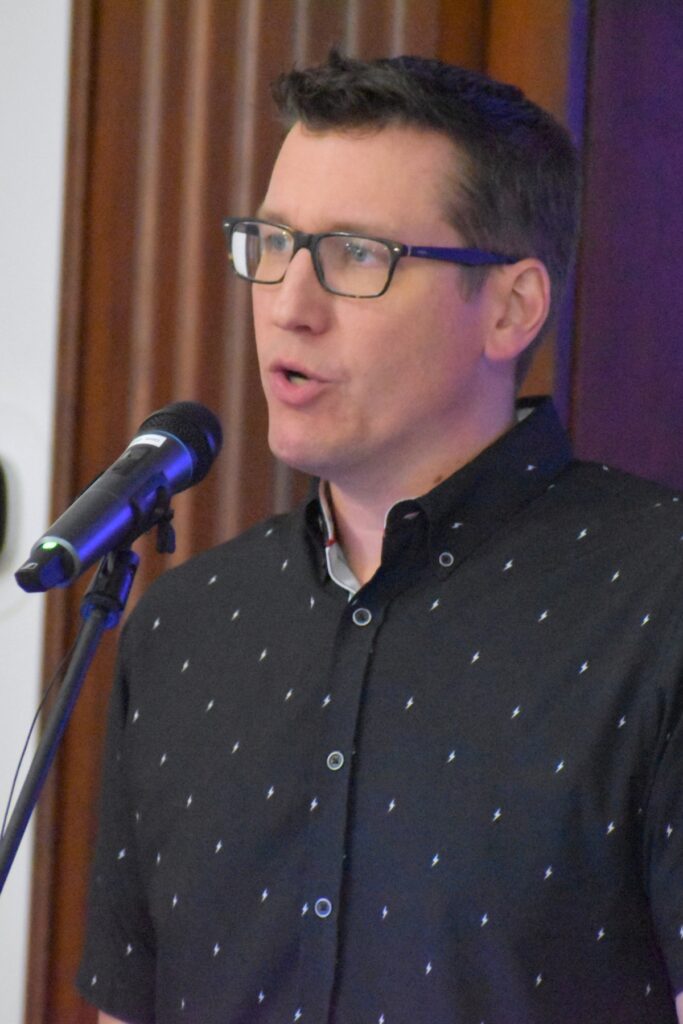 Joel Searby speaks at a town hall meeting on Wednesday.