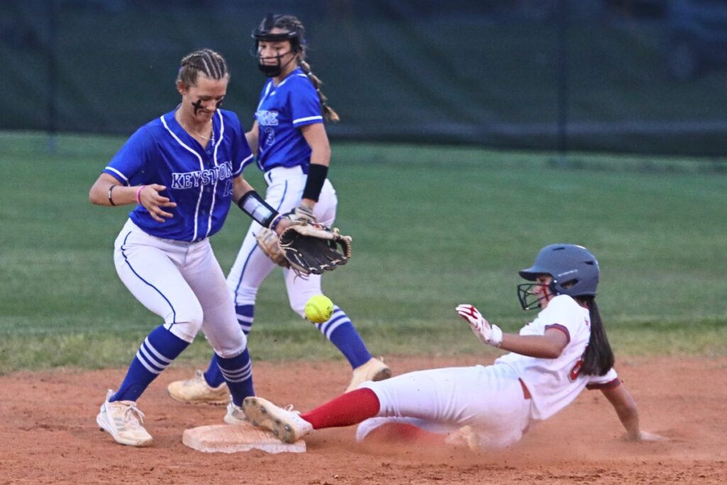 Santa Fe's Montana Moen beats the throw to Keystone Heights Abbie Roach at second base in the bottom of the second inning.