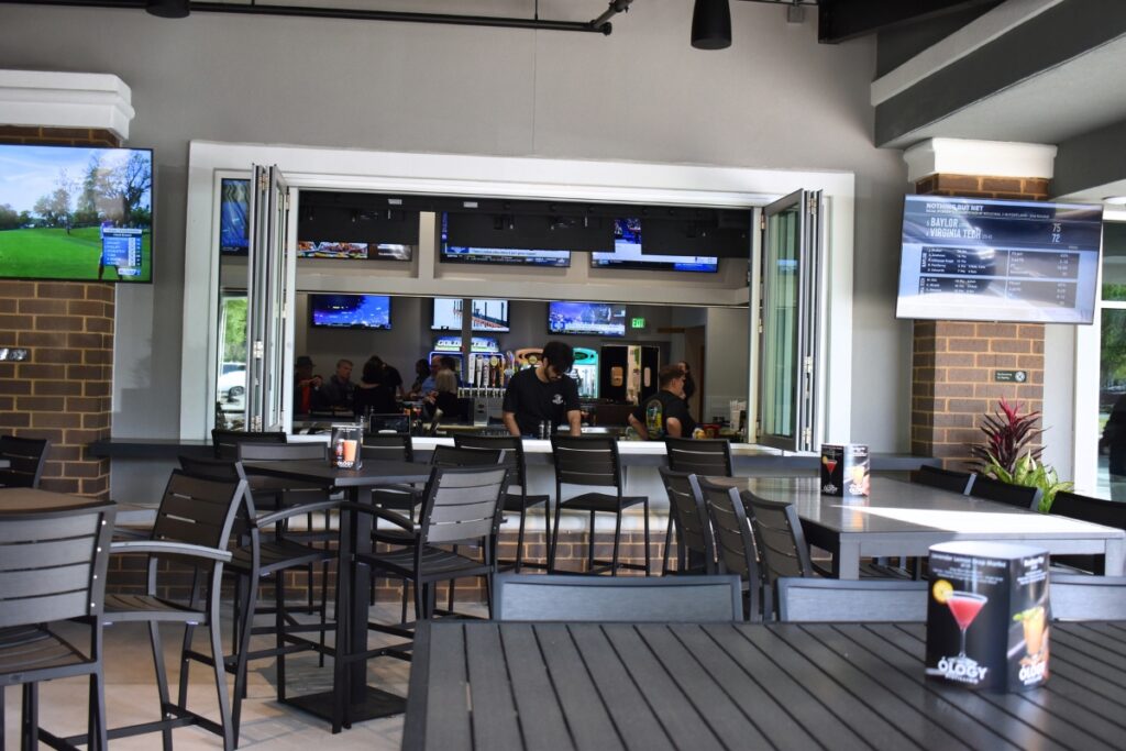 The indoor and outdoor bar area maintains an open feel.