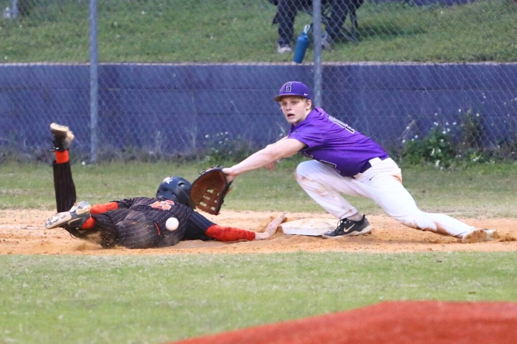 Trenton's Dax Becker beats a pickoff attempt at first base to Gainesville's Connor Kemph.