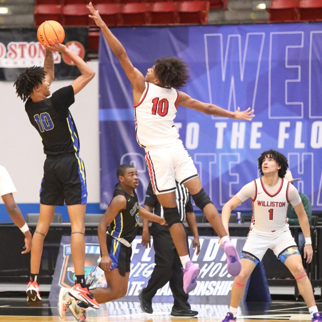 Williston's Kyler Lamb attempts a shot block against Chipley in the Class 1A State Semifinal game at FP Funding Center in Lakeland.