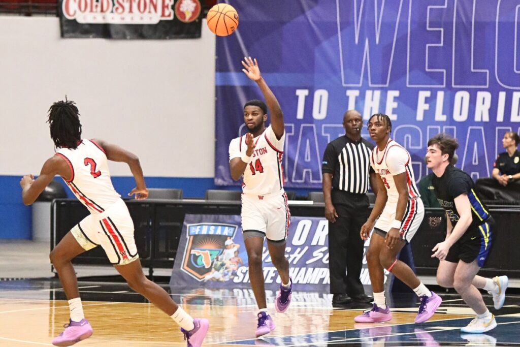 Williston's Quincy Parker passes the ball downcourt to Javon Brown (2) against Chipley in the Class 1A State Semifinal game at FP Funding Center in Lakeland.