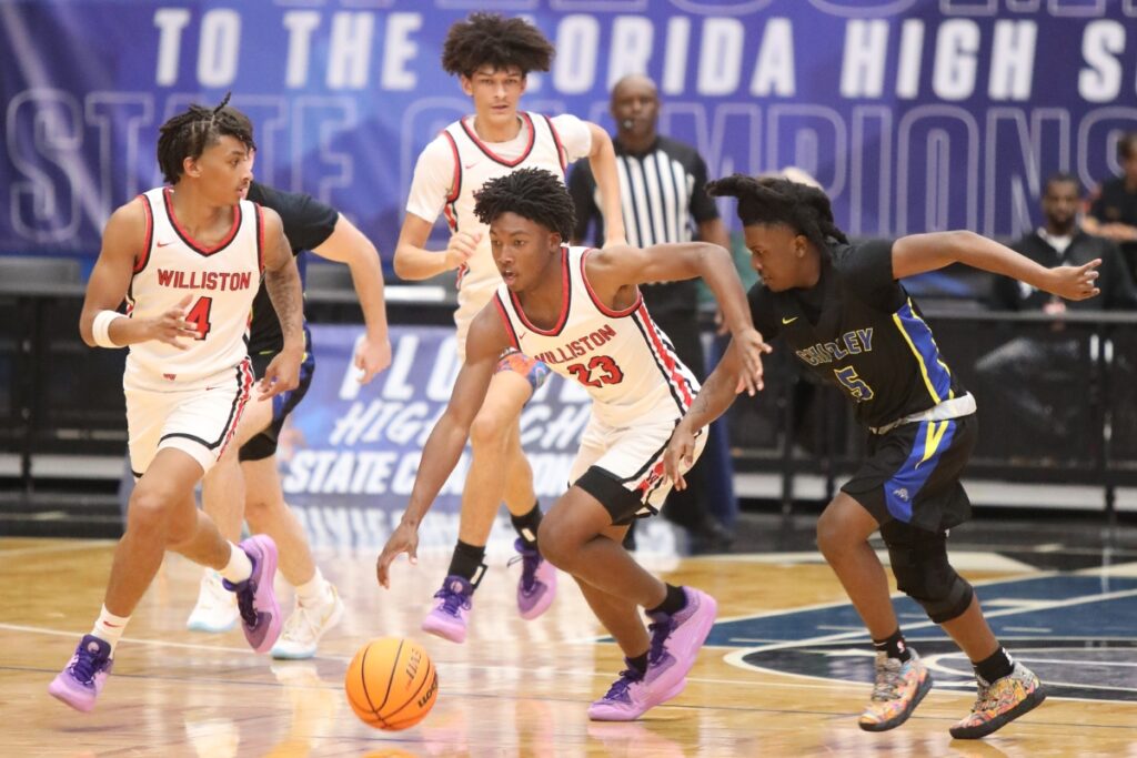 Williston's Traeston Armstrong brings the ball down the court against Chipley in the Class 1A State Semifinal game at FP Funding Center in Lakeland.