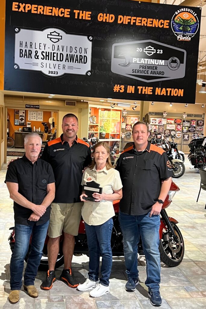 (From left) Steve Sabo, field service manager for Harley-Davidson Motor Company, Inc., Gainesville co-owners Kevin Lytle, Gail Lytle and Paul Lytle.
