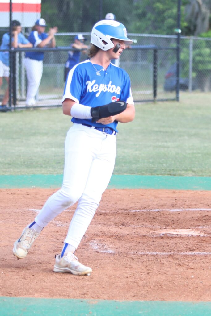 Keystone Heights' Austin Smith scored the first run of the game for the Indians in the top of the second inning against Santa Fe.
