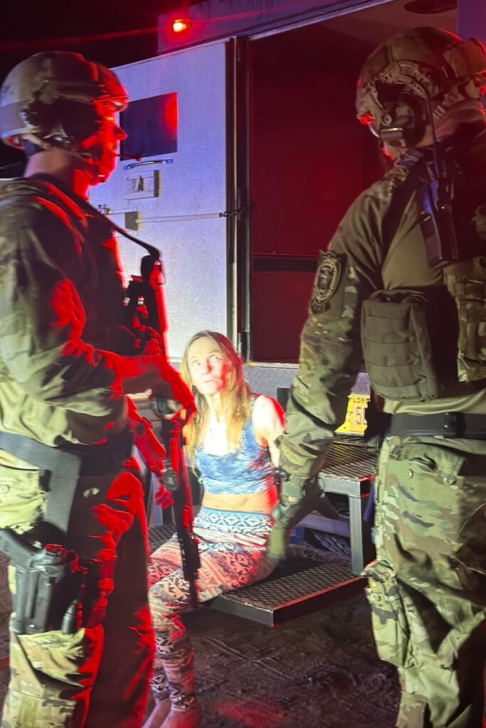 Law enforcement after arresting Diane Chamberlin in connection with the stabbing murder of Emory Crews Jr.