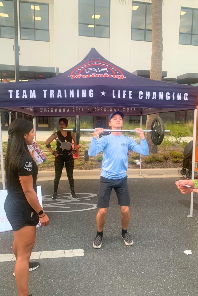 Man lifts the weights 20 times to win a free week at F45 Training.