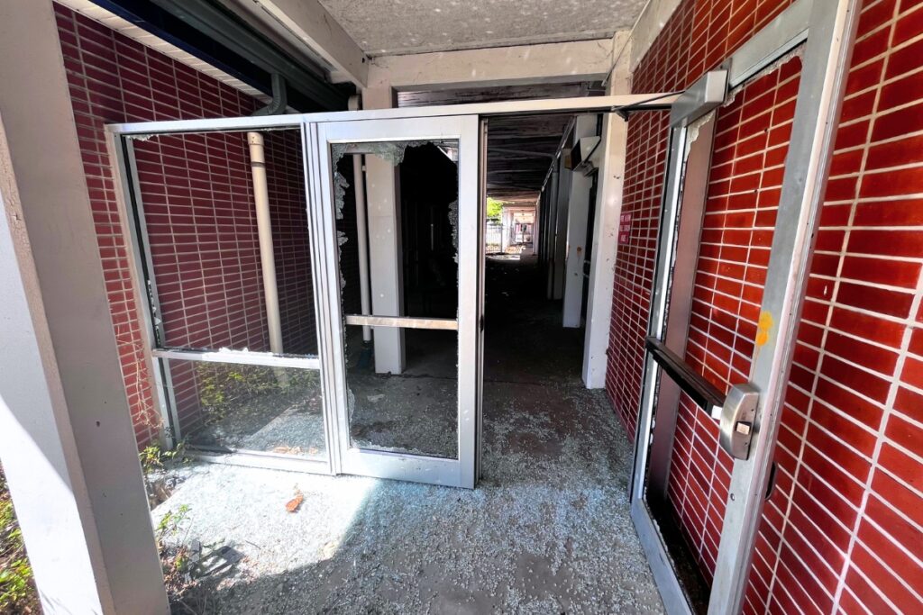 Shattered glass is found at doors and windows throughout the old Terwilliger Elementary School.