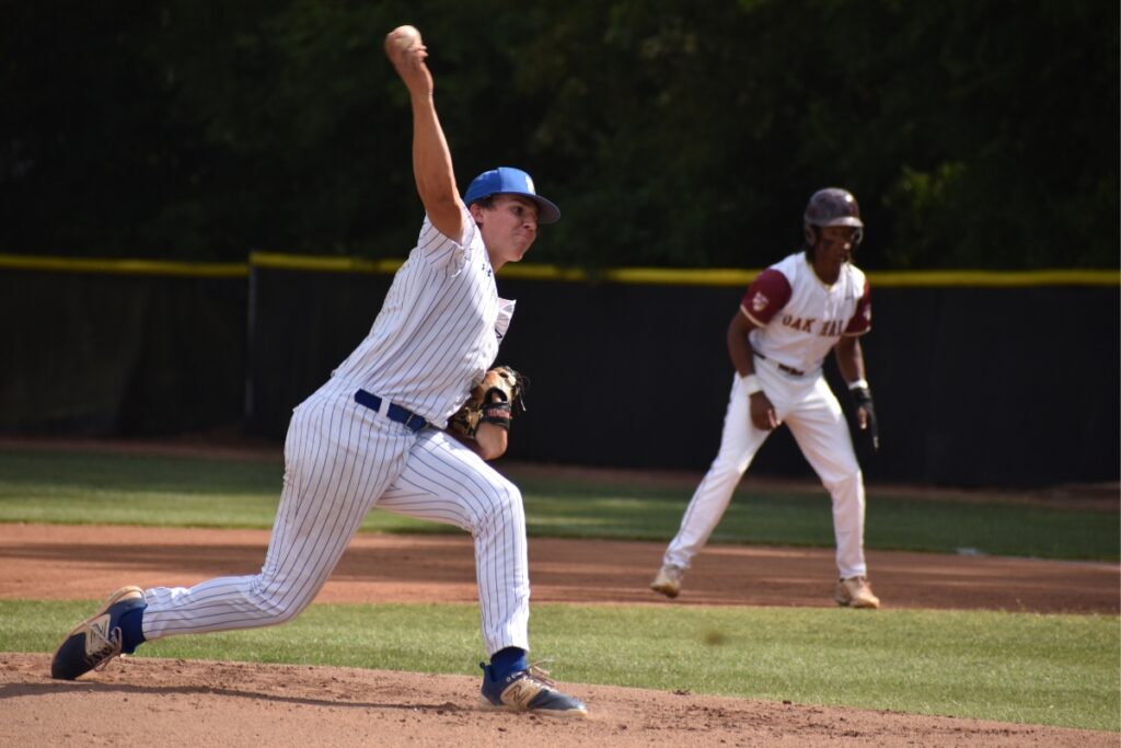 Saint Francis Catholic's Liam Green pitches in the first inning. 