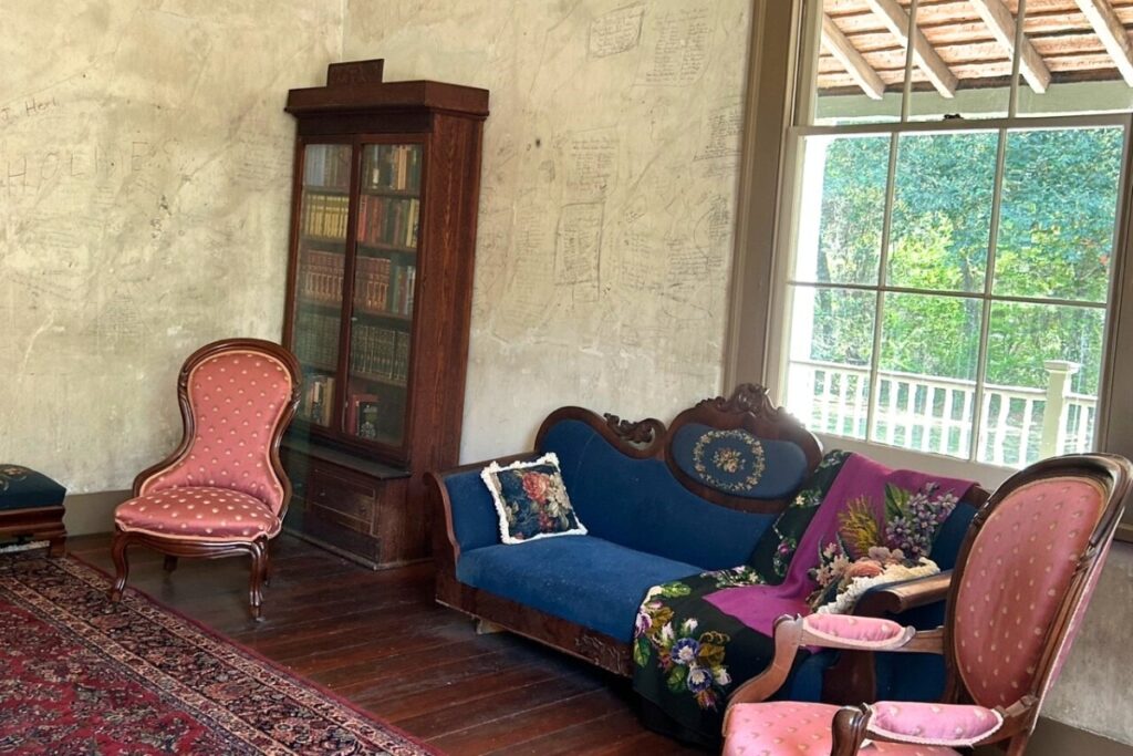 A parlor at Historic Haile Homestead with an example of another talking wall.