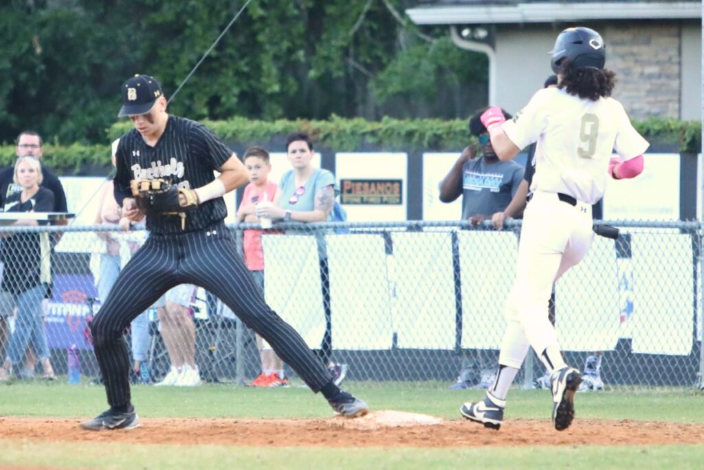 Buchholz's Austin Cardozo secures a throw to first base for an out against Oakleaf in the District 3-6A Semifinal on Tuesday.