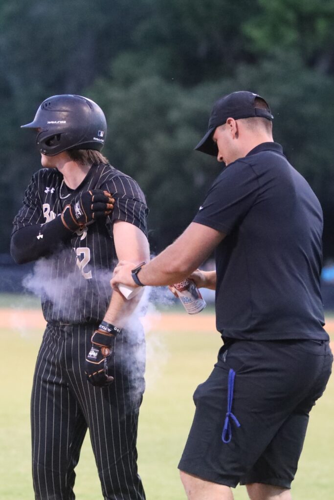 Buchholz's Conner Brown gets treatment for his left elbow after being hit by a pitch on Tuesday in a Class 6A-Region 1 Quarterfinal win over New Smyrna Beach.
