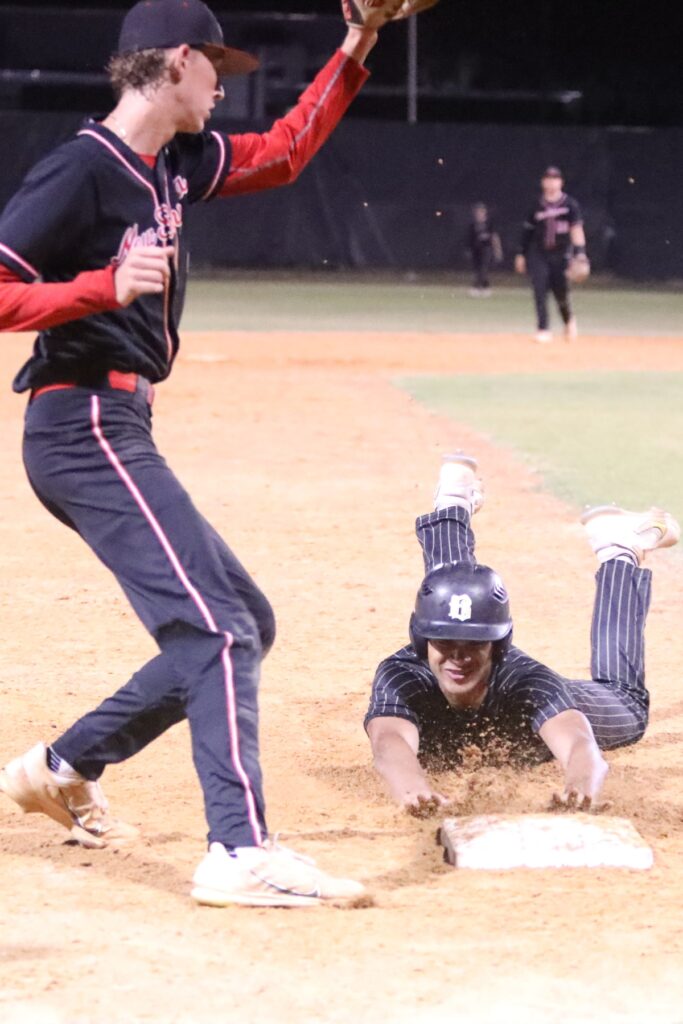 Buchholz's Justin Williams slides safely into third base in a Class 6A-Region 1 Quarterfinal win over New Smyrna Beach on Tuesday.