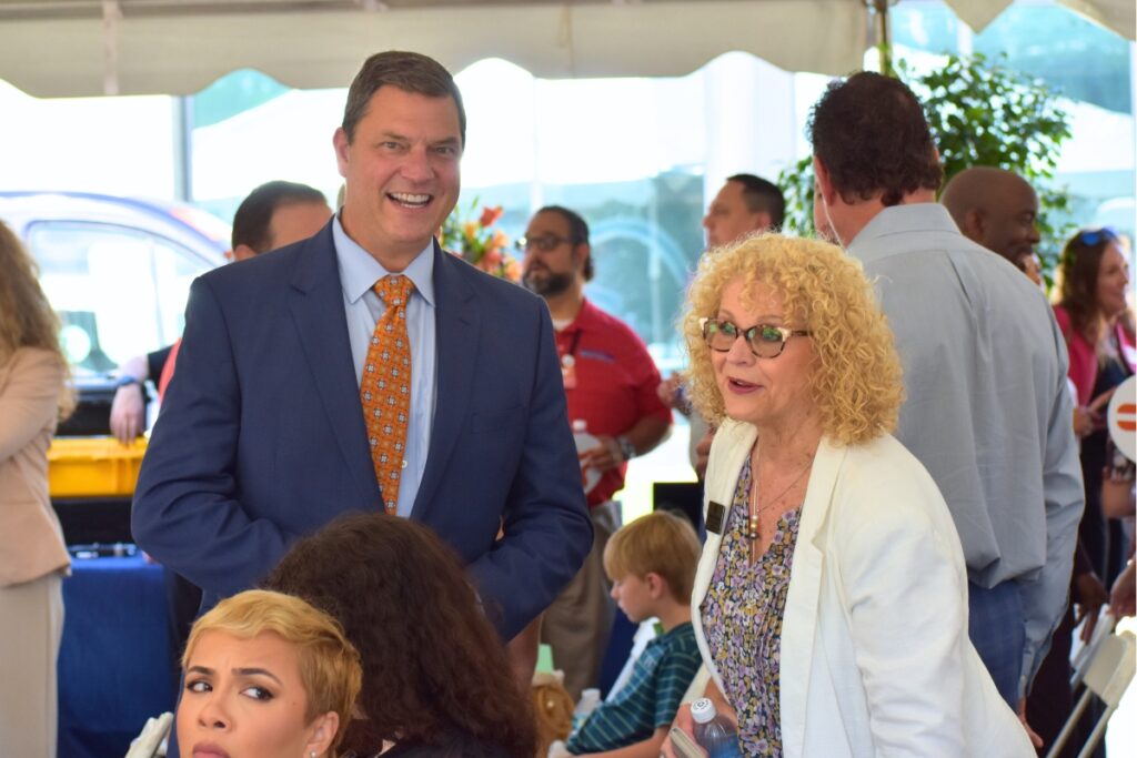 Eric Lawson speaks with Jeannie Rickman at the groundbreaking.