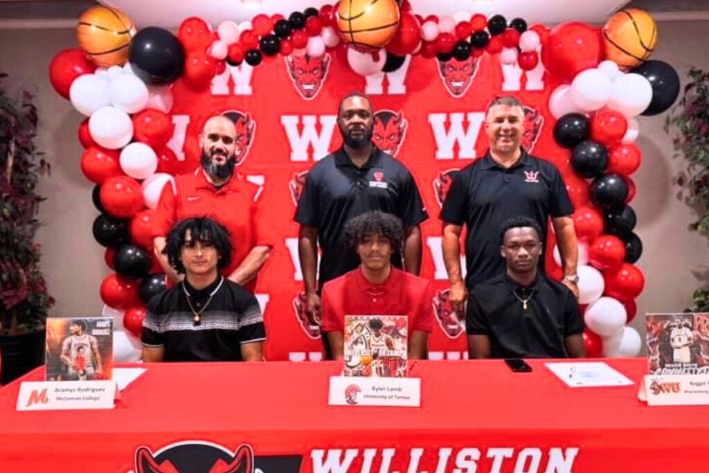 (Front row from left) Williston's Aramys Rodriguez, Kyler Lamb and Reggie White signed to play college basketball on Wednesday.