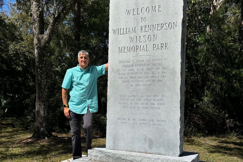 Jim Wilson stands beside the monument honoring his uncle.