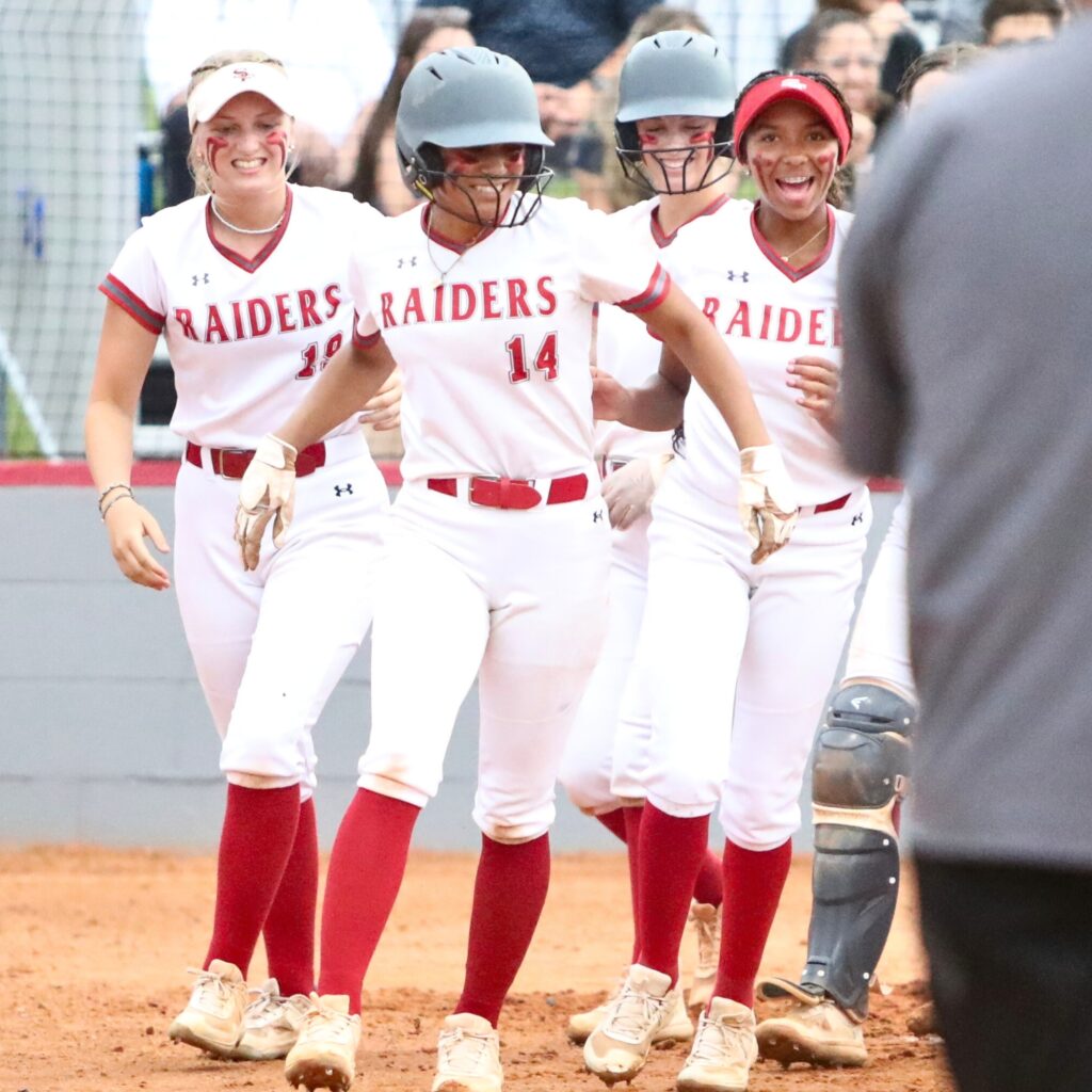 Santa Fe's Amy Crosby (14) hit a third inning home run for a 1-0 lead against Trinity Prep (Winter Park) in the Class 3A-Region 2 Semifinal on Tuesday.