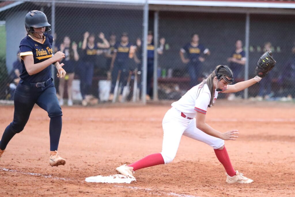 Santa Fe's Montana Moen stretches for an out at first base in the fifth inning against Trinity Prep (Winter Park) in the Class 3A-Region 2 Semifinal on Tuesday.