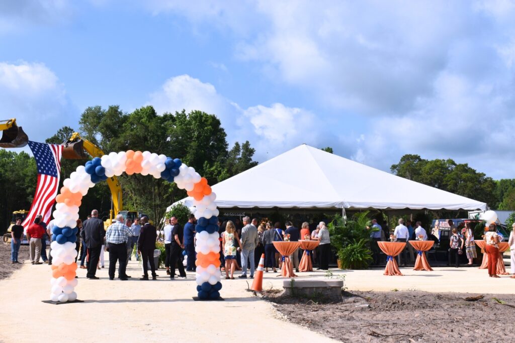 The joint ribbon cutting and groundbreaking drew over a hundred attendees.
