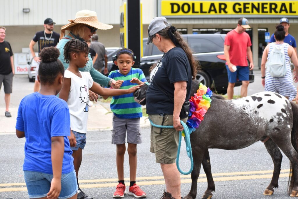 The ponies at the tail end of the parade stopped several times to greet young attendees.