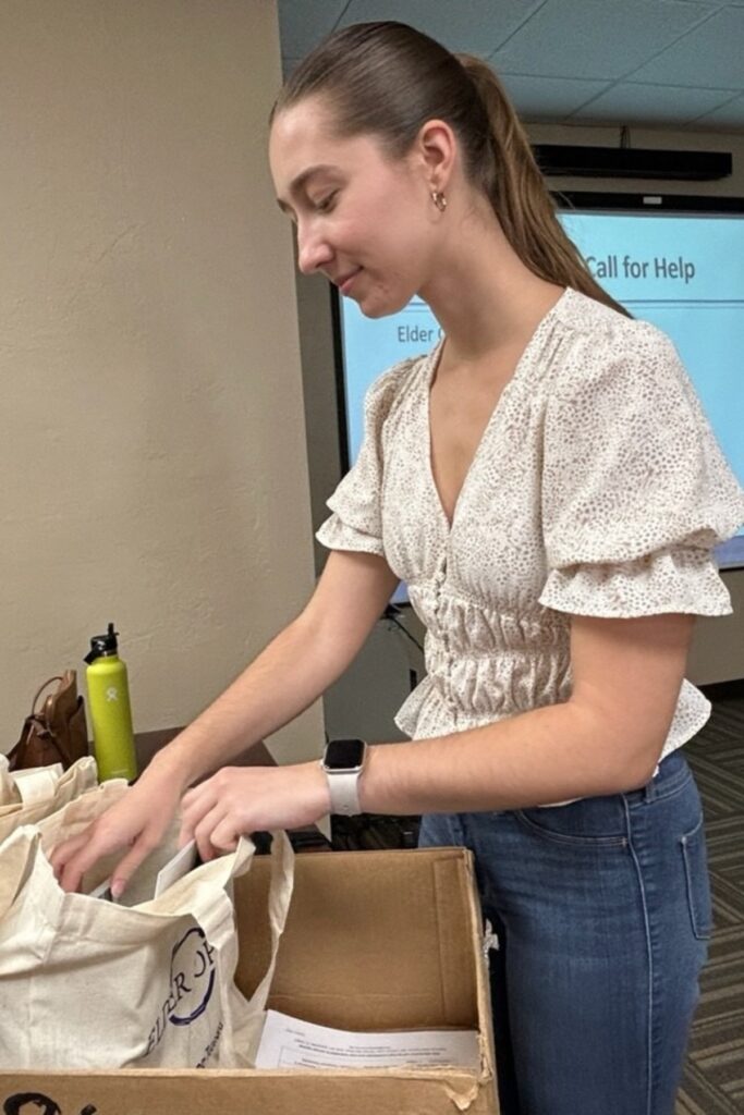 Elder Options caregiver support coach Amanda Sparkman preparing supplies.