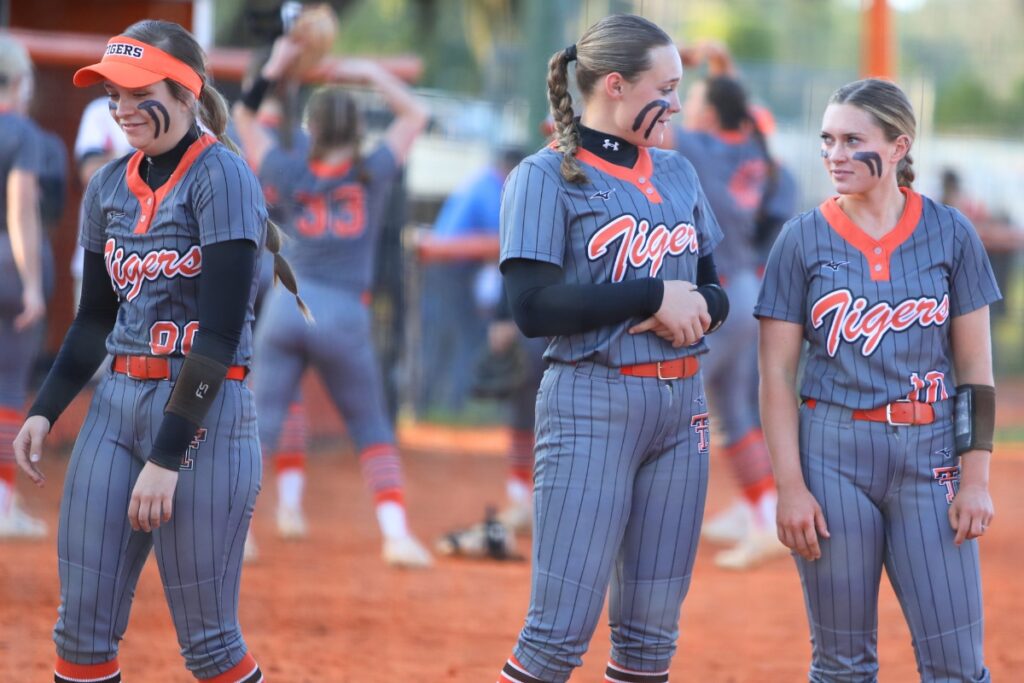 (From left) Trenton's Brandy Dees, Addison Allaire and Olivia Weaver were named to the Small School All Area Softball Team after leading the Tigers to a Class 1A state championship. 