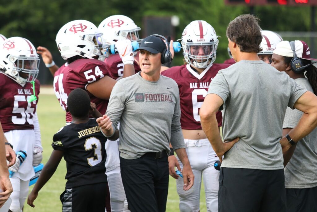 R.J. Fuhr (center in black hat) announced he is stepping down as Oak Hall's head coach and will be the new offensive coordinator at Union County.
