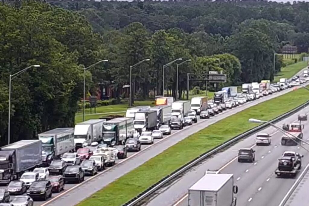 Traffic came to a stop on I-75 southbound near the Newberry Road exit in Gainesville following an accident involving four tractor-trailers and one car.