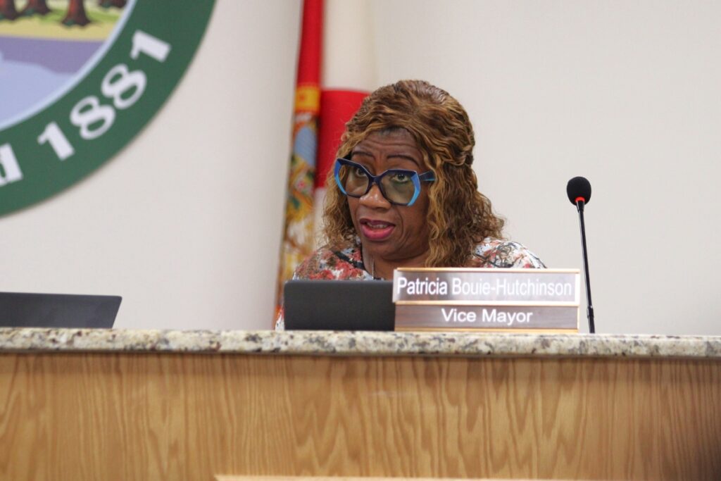 Vice Mayor Patricia Bouie-Hutchinson sits behind the dais.
