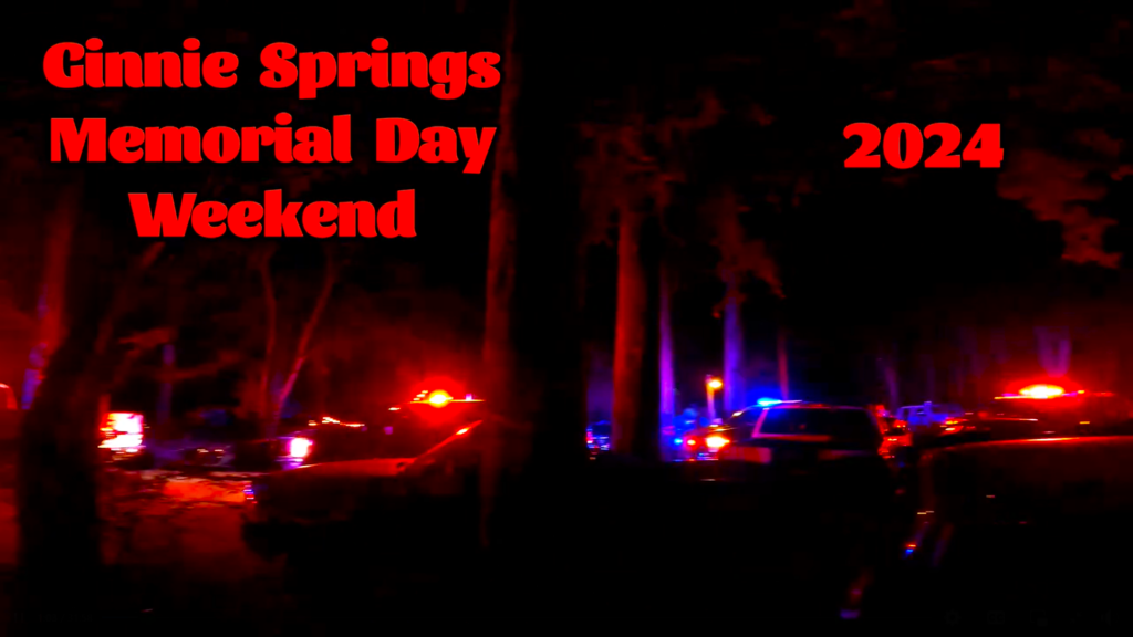 A screen shot shows police lights flashing in the dark as law enforcement responds to a second shooting at Ginnie Springs. 