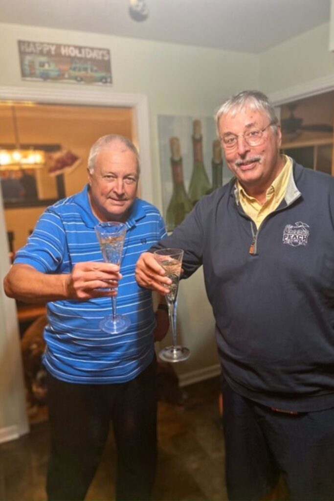 Andreu and Dooley toast to their retirement after covering their last UF football game together on Nov. 28, 2020.