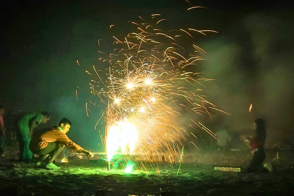 Children lighting fireworks.