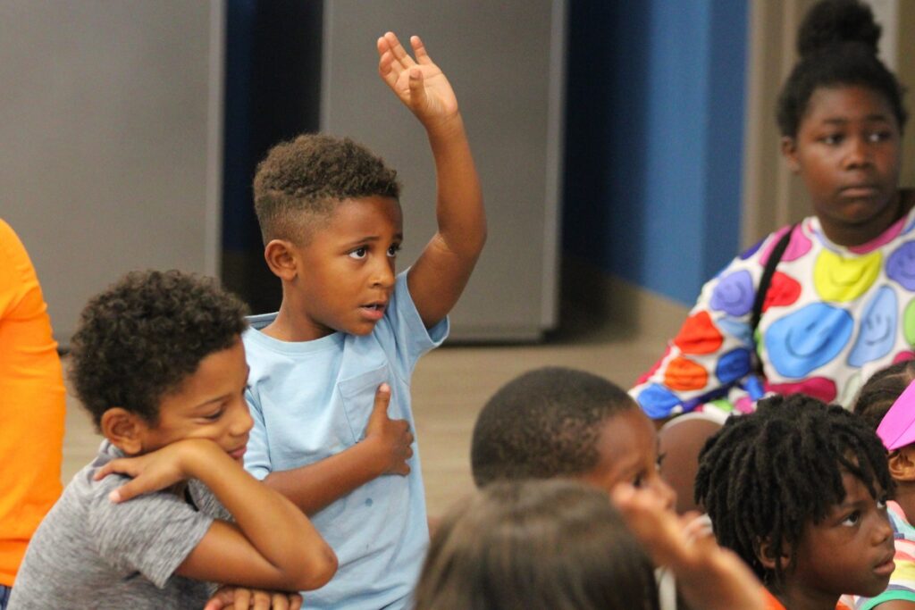 Dash Robinson and Malakhi Pierre participate in a question-and-answer time with Judge Meshon T. Rawls, the guest reader.