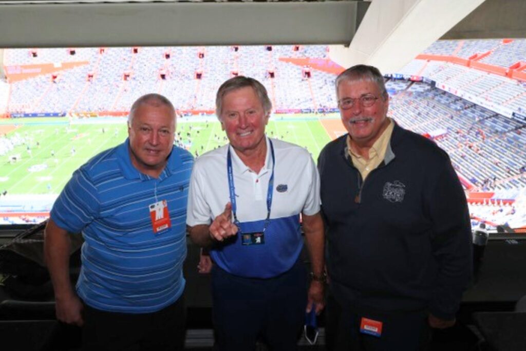 (From left) Robbie Andreu, Steve Spurrier and Pat Dooley pose in the Ben Hill Griffin Stadium press box on Nov. 28, 2020, at the Florida-Kentucky football game.