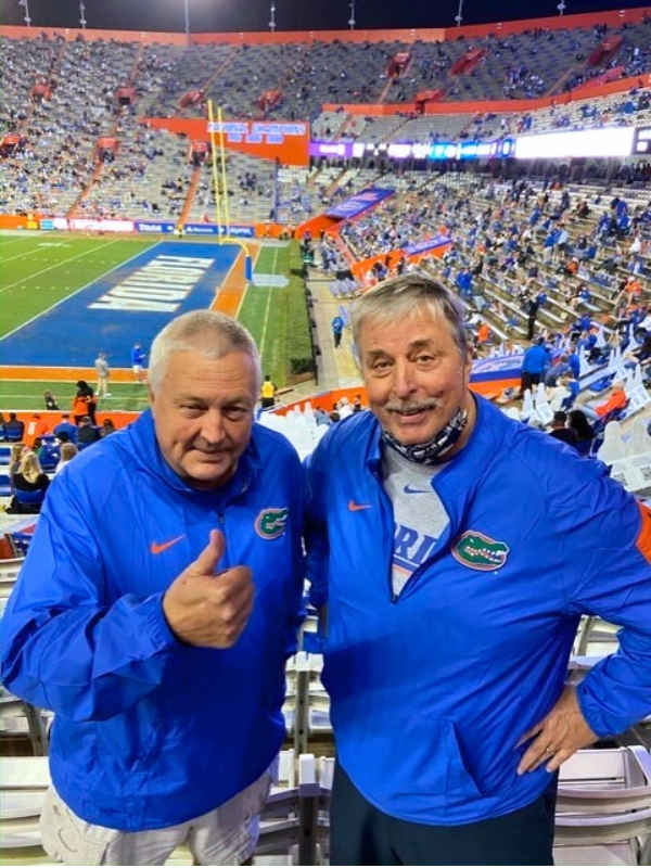 Two weeks after their retirement in November 2020, Robbie Andreu and Pat Dooley attend their first Florida game together as fans in more than 40 years, this one against LSU on Dec. 12, 2020.