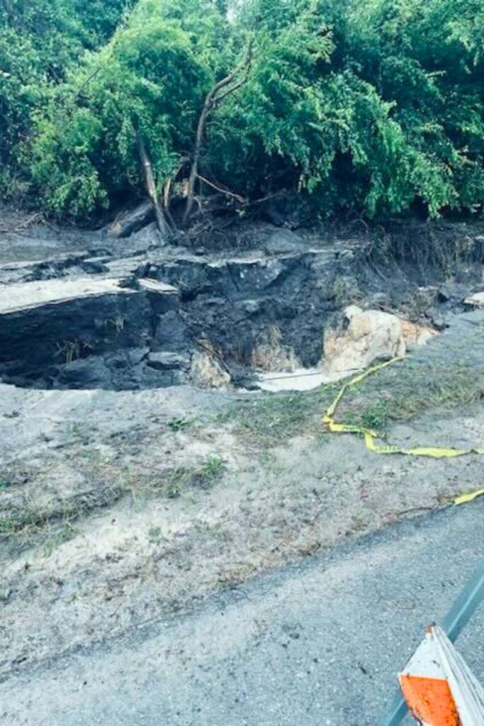 A giant sinkhole emerged next to State Road 26 between the Gilchrist County line and city of Newberry on Monday.