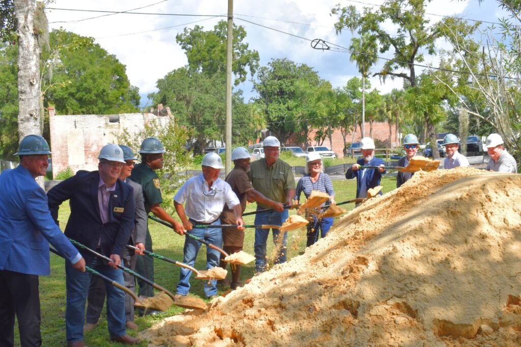 Local officials break ground for the new city hall building.