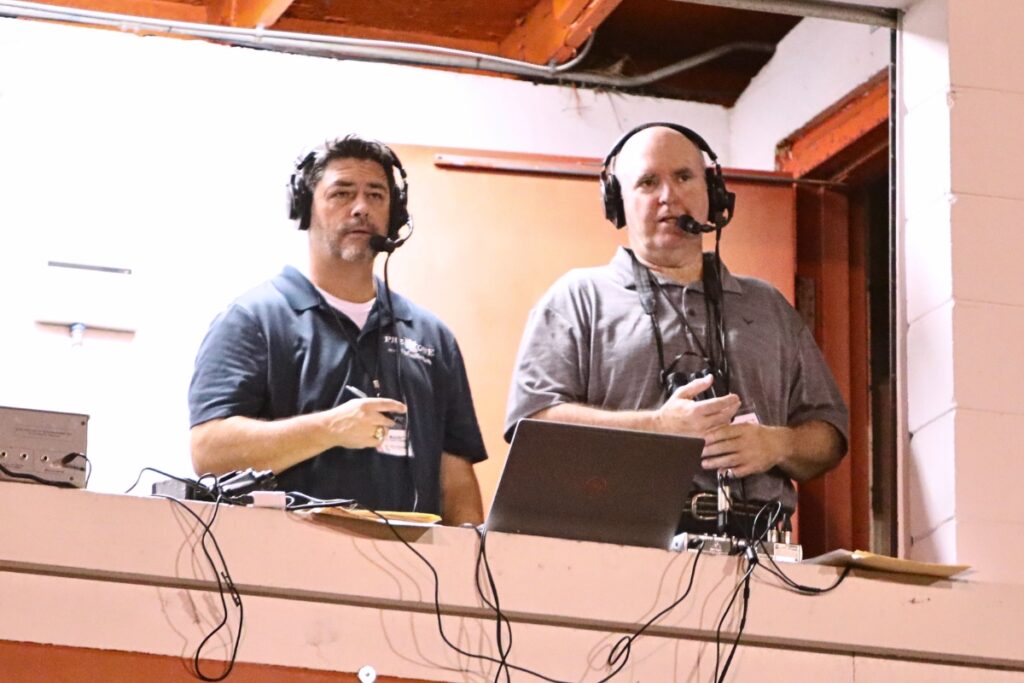 Mainstreet Daily News Sports Director Mike Ridaught (left) and former Gator football player Hank Rone enter their third season calling high school football games together on 106.9 FM I am Country this fall