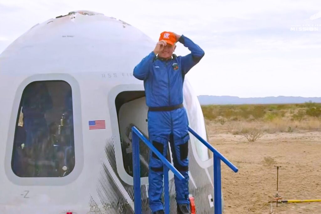 Rob Ferl puts on a UF cap after exiting the RSS First Step capsule. Courtesy Blue Origin on YouTube