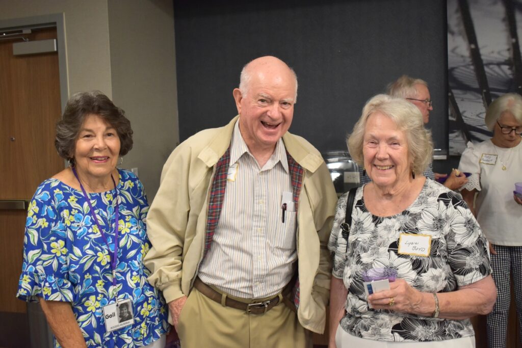 L-R: Gail Rogers MacMillan, Lamar Willis and Lynn Boyd laugh at the high school reunion.