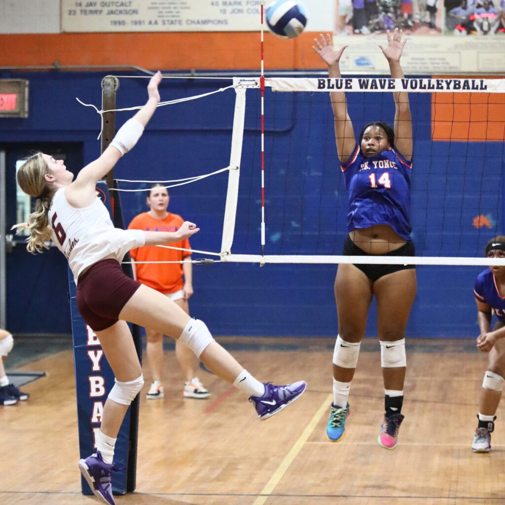 Oak Hall's Hannah Timm (6) with a hit against P.K. Yonge's Ajha Grady (14) on Thursday.