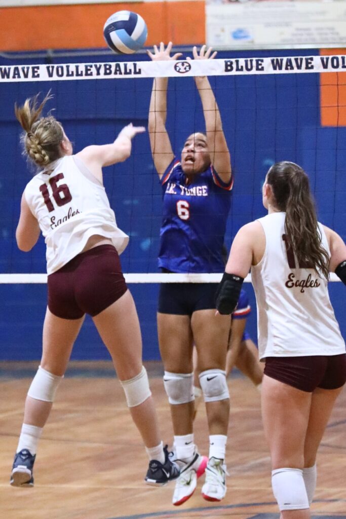 Oak Hall's Paige Sherrod (16) with a hit against P.K. Yonge's Lucy Hampton (6) on Thursday.